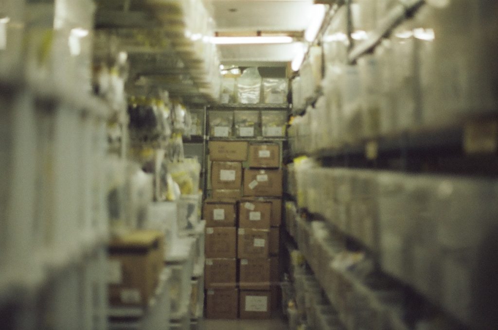 Evidence room with boxed evidence on shelves.